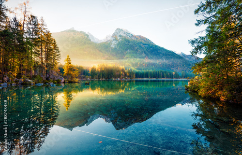 Amazing autumn sunrise of Hintersee lake. Fantastic morning view of Bavarian Alps on the Austrian border, Germany, Europe. Beauty of nature concept background. Orton Effect. © Andrew Mayovskyy