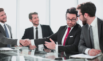 Wall Mural - handshake of financial partners at a meeting in the office