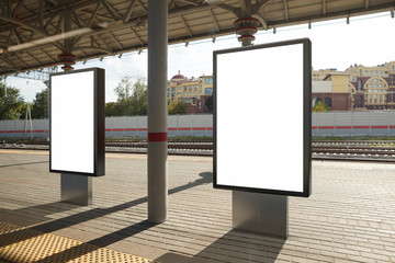 Blank billboard poster stand mock up on platform of raillway station