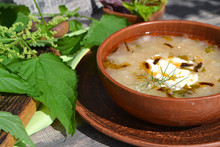 Spring Vegetable Soup With Nettle In Rustic Bowl
