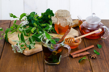 Wall Mural - Herbal tea with mint and honey. Photo