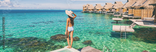 Fotomural Travel luxury resort panoramic banner woman tourist enjoying view from overwater bungalow hotel in Maldives panorama