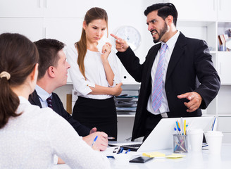 Wall Mural - Businessman feeling angry to coworkers in office