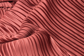 Pleat Fabric in long line drape with shadow, pleated style of textile pattern in red burgundy color put in layer design wave wallpaper, studio lighting close up background image