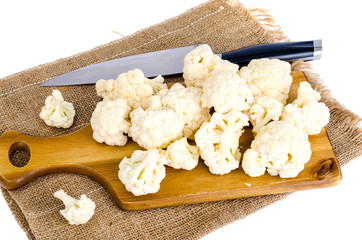 Wall Mural - View of cauliflower on  cutting board, isolated.