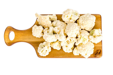 Wall Mural - View of cauliflower on  cutting board, isolated.