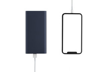 Power Bank And Smartphone On White Background. The Smartphone Is Charging From The Power Bank.