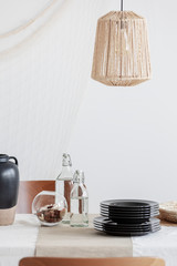 Wall Mural - close-up of designed beige lamp above table