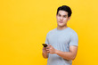 © Atstock Productions - Young good looking Asian man in casual style holding a smartphone