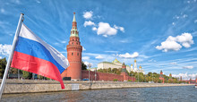 Moscow City Russia Kremlin And Russian Flag State Symbol Architecture Famous Landmark Background Panorama Wide River View Of Russian Capital Red Wall And Tower Buildings Historical Town Center Skyline