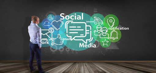 Businessman holding a cloud of social media network icon