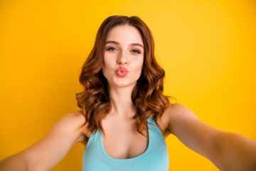 Poster - Photo of lady making selfies sending instagram followers air kisses wear tank-top isolated yellow background