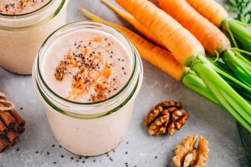 Wall Mural - Healthy carrot cake smoothie with walnuts and chia seeds in glass jars