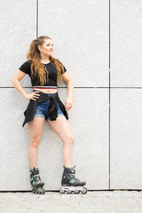 Sticker - Young woman riding roller skates