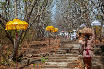 Wall Mural - Balinese people carry traditional religious offering to temple for ceremony