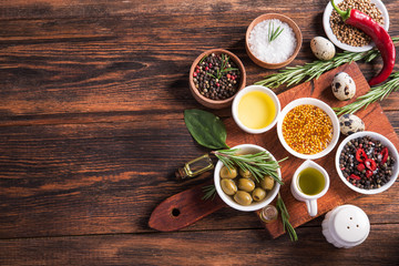 Wall Mural - Fresh salad ingredients (salt, pepper, olive, tomato, rosemary, oil )