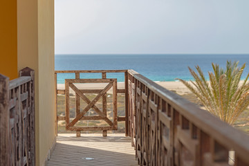 Wall Mural - An wooden balcony overlooking the sea.