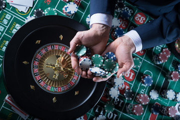 Wall Mural - Poker Chips with roulette, gambling games concept.