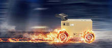 Priority Cardboard Box With Racing Wheels On Fire. Fast Shipping By Road.