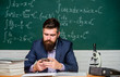 © be free - School teacher hold mobile phone chalkboard background. Teacher bearded man learn use modern technology. Learn technology. Modern communication. Send message. School application. Study technology
