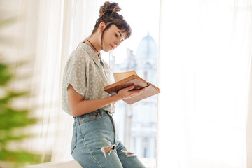 Sticker - Concentrated pretty cute young beautiful woman read book.