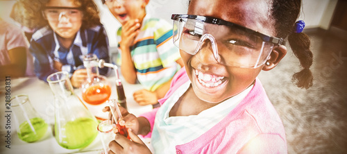 Fotografía Kids doing a chemical experiment in laboratory