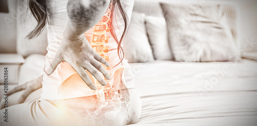 Fotografía Digital composite of highlighted spine of woman with back pain