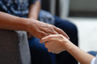 © inews77 - Hand of elderly woman holding hand younger woman, Helping hands, take care for the elderly concept.