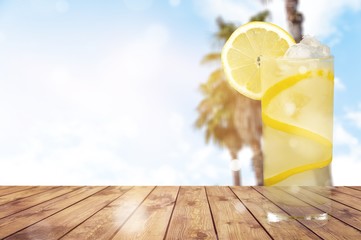 Canvas Print - Lemonade with fresh lemon on beach background