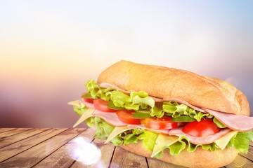 Wall Mural - Ham and cheese salad submarine sandwich from freshly cut baguette