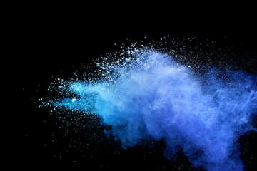 Wall Mural - Blue sky color powder explosion on black background.