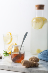 Wall Mural - Honey and Other Ingredients of Ginger Water, Including Lemon and Mint, Vertical Orientation