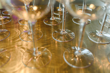 Poster - Group of empty transparent glasses ready for a party in a bar.