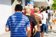 people  queue  in  line up   draggle , selective focus