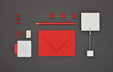 Wall Mural - Neatly organized red stationery flat lay on grey