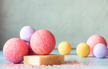 Colorful Bath Bombs, Handmade Soap And Salt On The Table, Grey Background, Copy Space. Home Spa Concept.