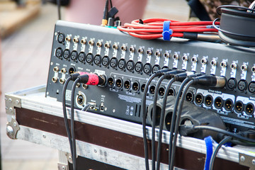 Wall Mural - Musical equipment on concert.Cables plugged in the inputs of mixing console