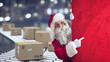 © alphaspirit - Santa Claus indicates a space for the Christimas present, with ready packages on background