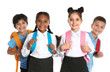 © New Africa - Happy children in school uniform on white background