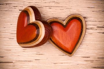 Two wooden hearts on rustic wood background. Valentines days concept.  Love symbol. Greeting card.