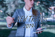 Text sign showing New Trends 2019. Business photo text general direction in which something is developing Outdoor background with business woman holding lap top and pen