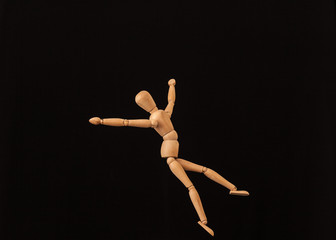 Canvas Print - jump happy wooden mannequin black background