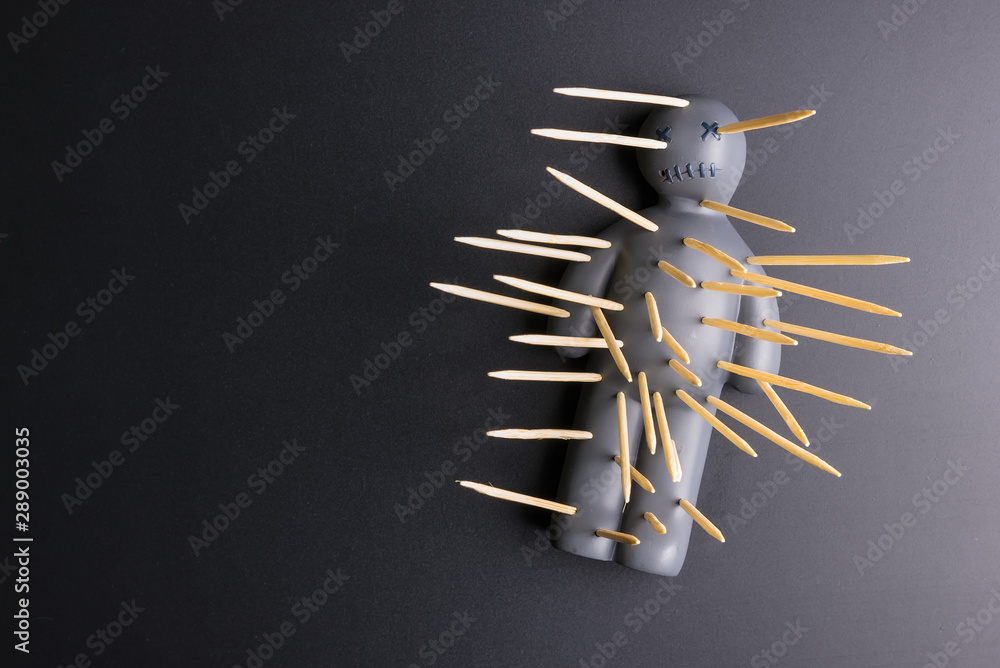 .Voodoo Doll on a black background with dramatic lighting. - obrazy, fototapety, plakaty 