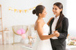 © Pixel-Shot - Beautiful lesbian couple during wedding ceremony