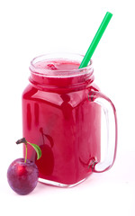 Sticker - plum juice in a glass with fresh plum fruit isolated on white background