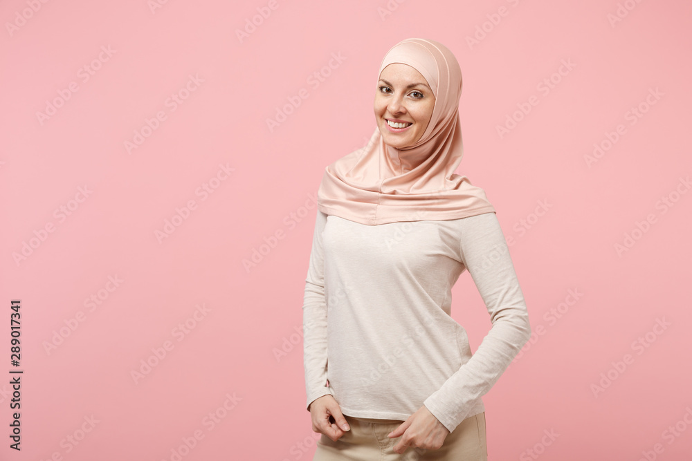 Download Beautiful Young Arabian Muslim Woman In Hijab Light Clothes Posing Isolated On Pink Background ...