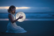 © Anton - Gentle image of a girl, Astrology, Female magic. Beautiful attractive girl on a night beach with sand hugs the moon, art photography