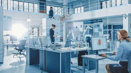 Aufkleber - Diverse Team of Engineers Working on Computers, Program and Manipulate Robot Arm, Discuss Problems in Bright Industrial Robotics Technology and Design Office. Working in Research Facility.