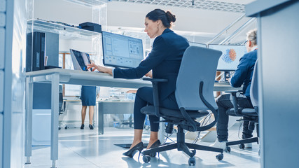 Fototapete - Back View of Team of Technology Engineers Working on Desktop Computers in Bright Office. Screens Show IDE / CAD Software, Implementation of Machine Learning, Neural Networking and Cloud Computing