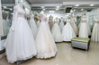 Interior of bridal salon, wedding dresses on mannequins